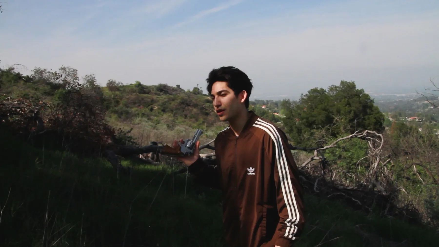 Ian Bloom in Driver 2016 as the Driver holding a gun